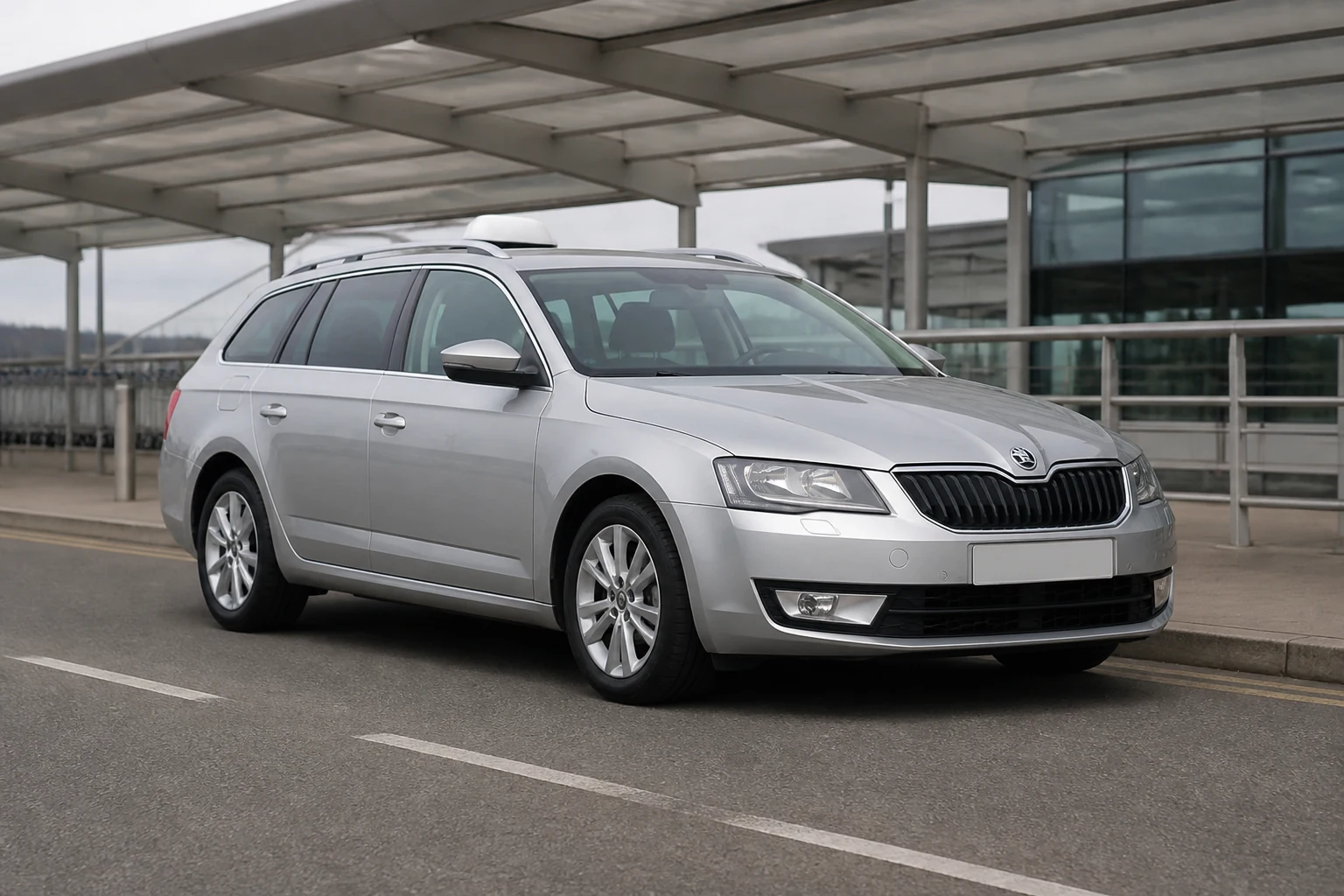 Silver estate taxi at a quiet airport drop-off kerb
